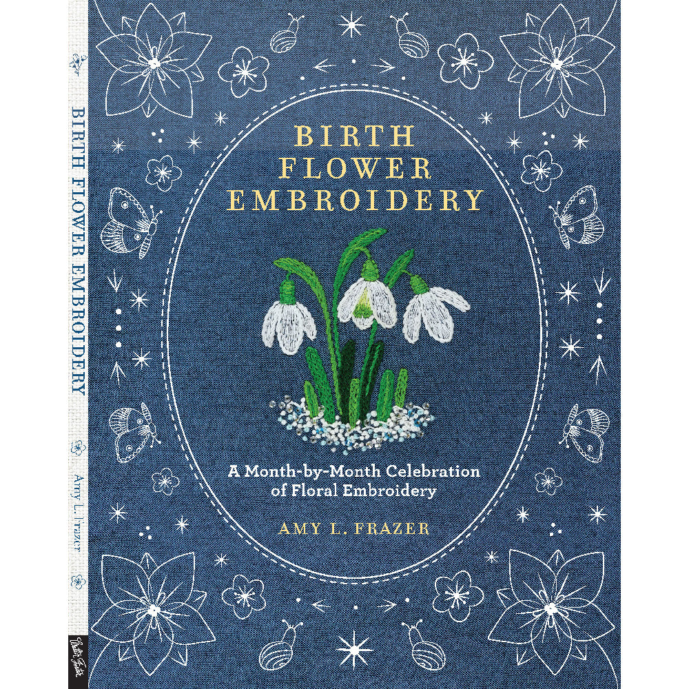 Book cover of 'Birth Flower Embroidery' with floral design and text on a blue background
