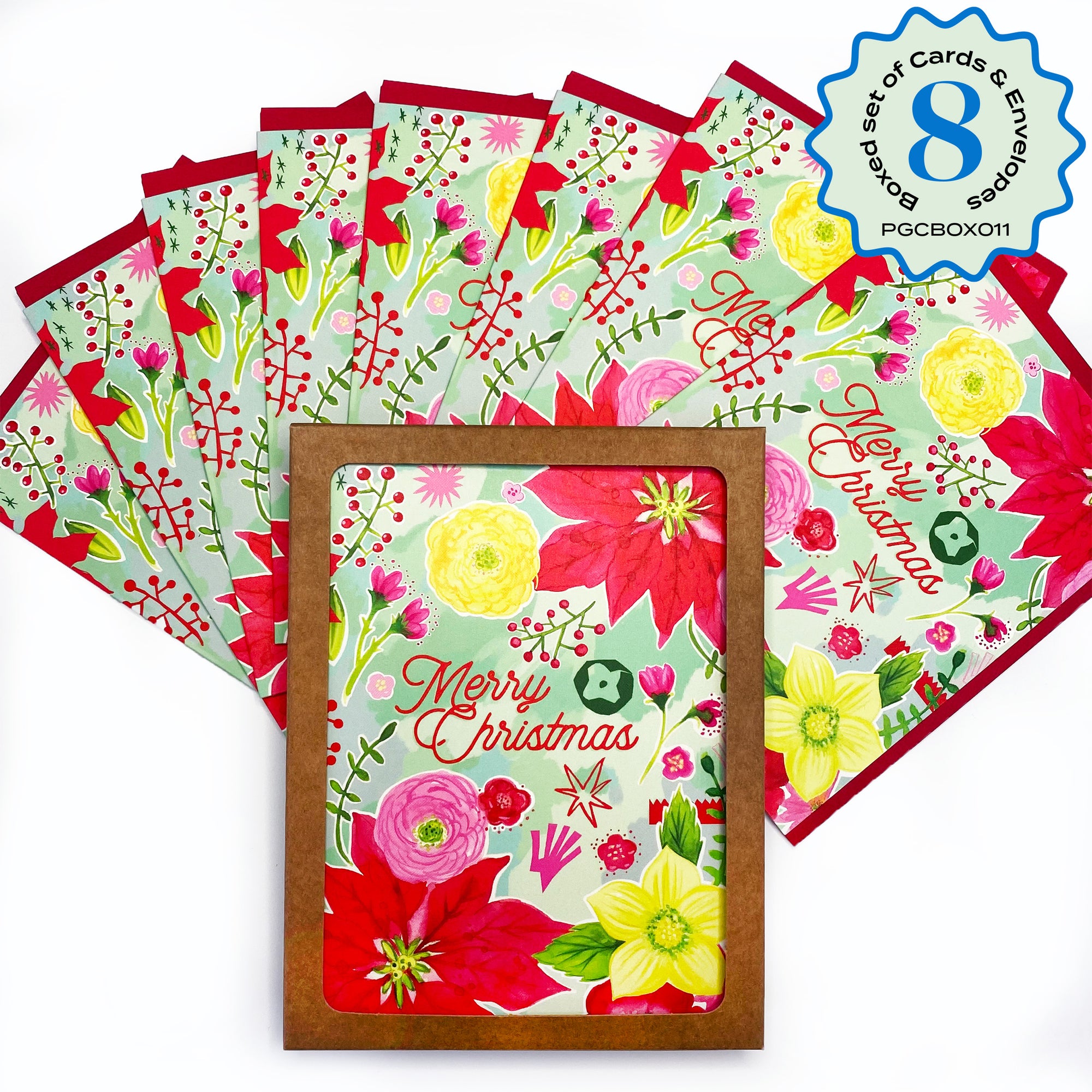 Merry Christmas floral card set of 8. Packaged in a Kraft box with a window on front so you can see the card. Mint green background, red pointsettias, yellow roses, pink ranunculus. 