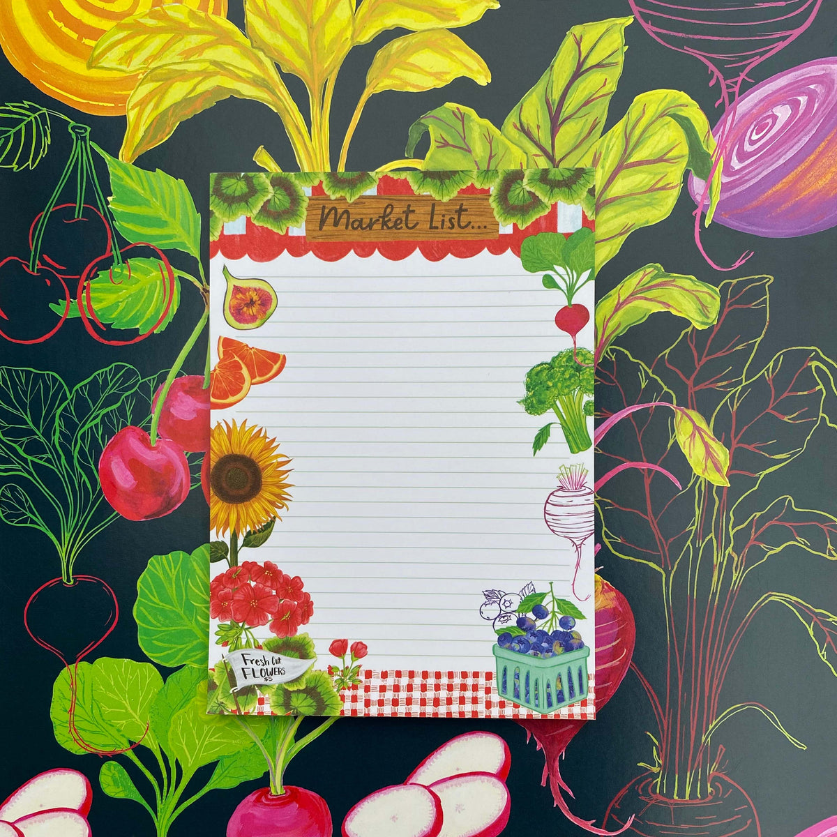 black background with colorful fruits and vegetables. A Market List Notepad sits on top of this illustration containing illustrations of fruits, vegetables and flowers. 