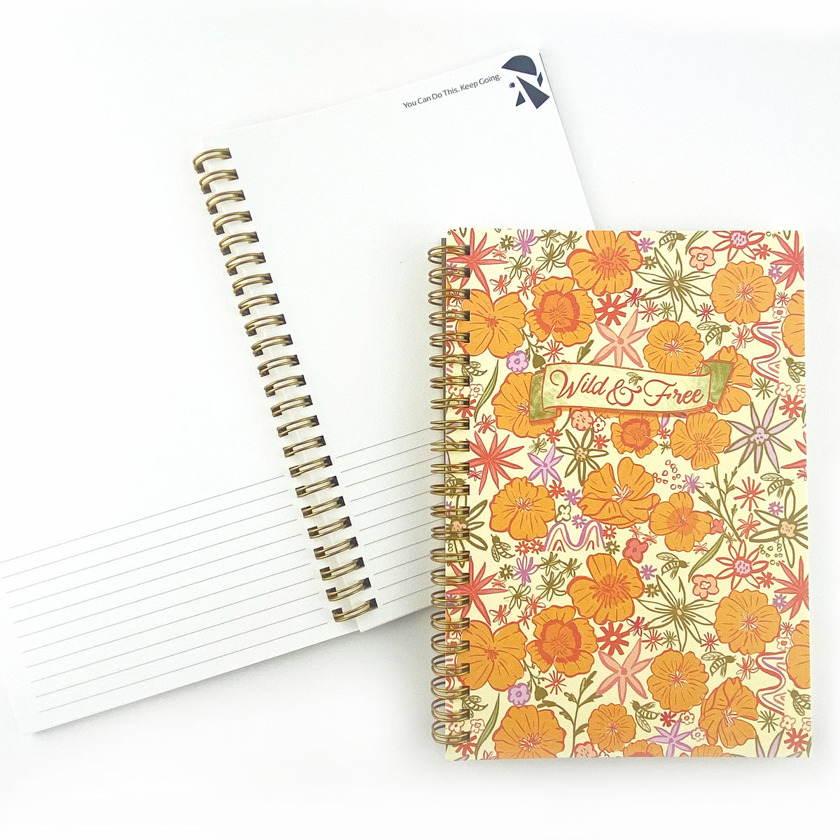 Spiral Bound Notebook with hand drawn colorful poppies and wildflowers in tones of orange , red, lavender and gold on a cream background. In the center is the handlettered phrase Wild and Free on a cream colored banner.