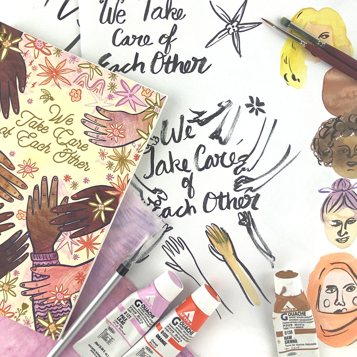 Spiral Bound notebook with hand drawn artwork of multi racial hands and flowers. In the center text says We Take Care of Each Other. White background with black in drawings and 3 tubes of colorful paint, paint brush, and illustrations of women&#39;s faces. 